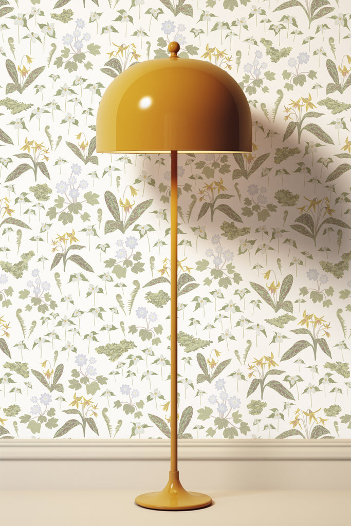 Tall yellow floor lamp accentuating the Forest Blooms White wallpaper, bringing the vitality and fragrance of spring indoors
