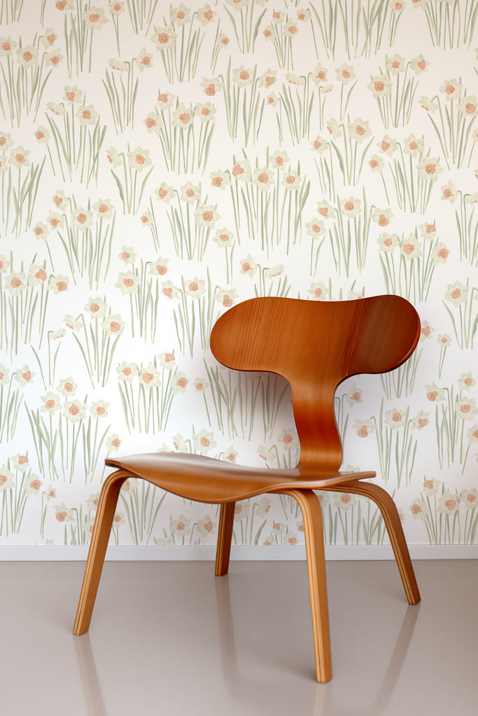Stylish wooden chair accentuating the Daffodil White Wallpaper, illustrating the wallpaper's versatility in contemporary decor.