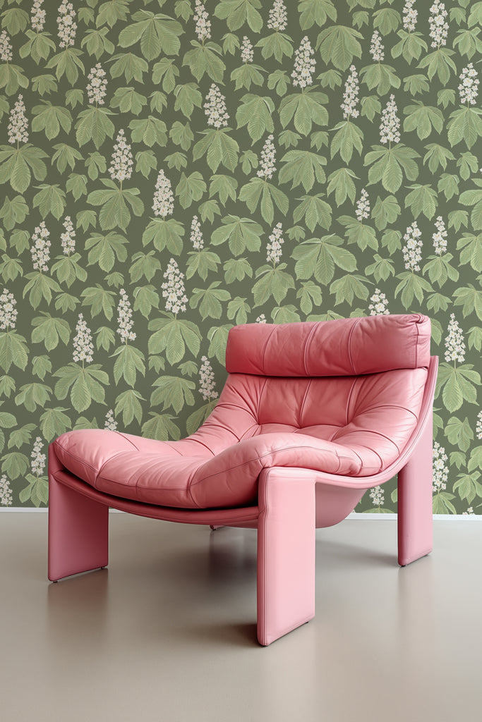 Vintage pink chair against a Horse Chestnut Blossom Green wallpaper backdrop, embodying springtime splendour.