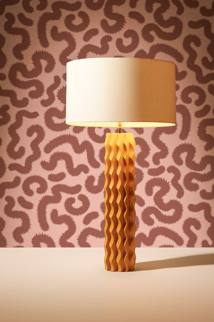 Modern lamp to complement Kate Golding's Spring Pop wallpaper in Oxblood and Pink, demonstrating a harmonious interior design.